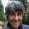 Woman with short grayish hair outside in the forest
